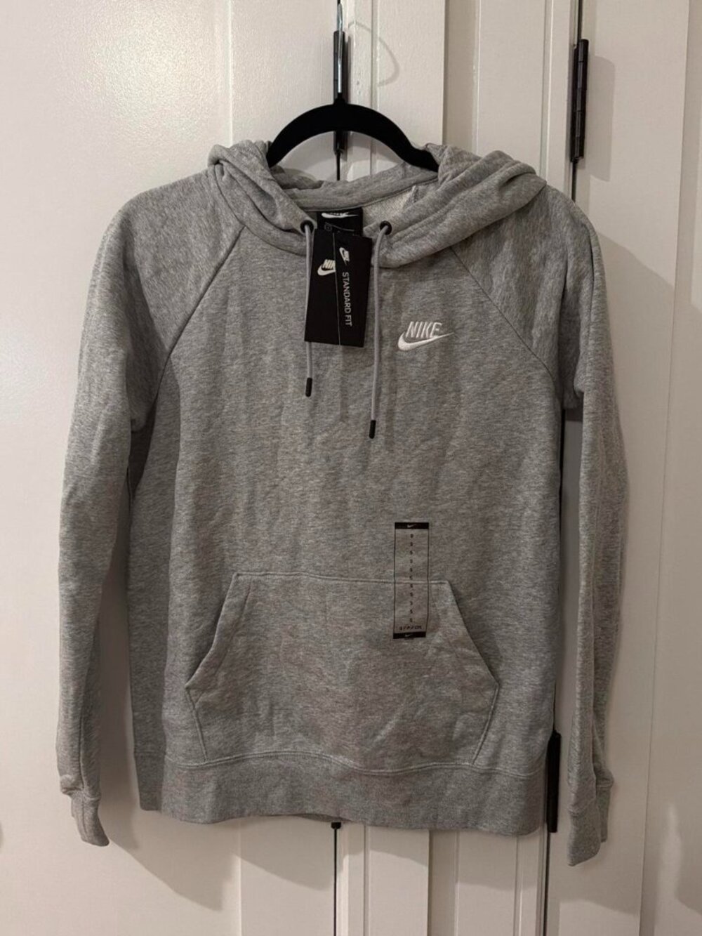 Gray Nike hoodie with drawstring hood and front pocket